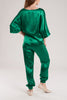 The emerald green silk satin suit is tailored from a sumptuously soft silk satin that ensures smoothness and comfort.
