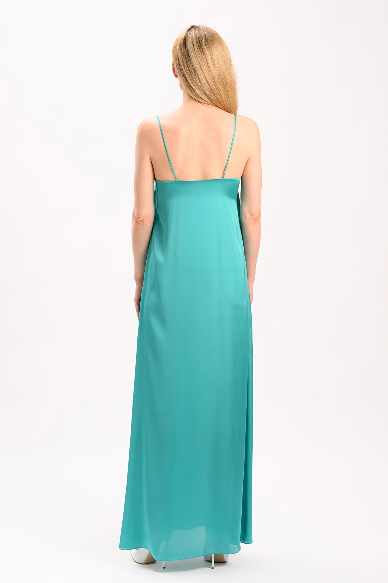 Long turquoise dress with thin straps.