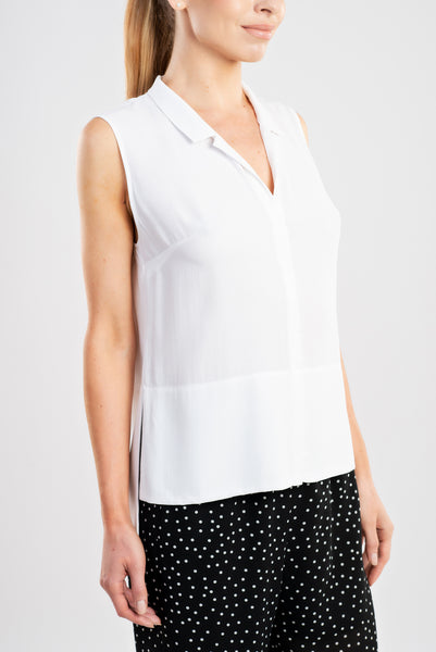This slip on blouse in endlessly versatile white will make any skirt or pair of trousers more elegant.