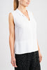 This slip on blouse in endlessly versatile white will make any skirt or pair of trousers more elegant.
