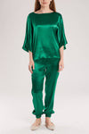 The emerald green silk satin suit is tailored from a sumptuously soft silk satin that ensures smoothness, comfort.