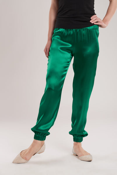 Part of a two piece emerald green silk satin suit, these pants are tailored from a soft silk satin that ensures comfort.