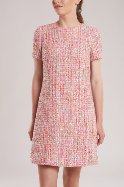 GINTA’s tweed dress is woven from vibrant pink, red and gold tweed, and is lined in light pink. 