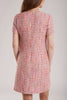 GINTA’s pink tweed dress has a figure-flattering shape and a concealed zip fastening at back.