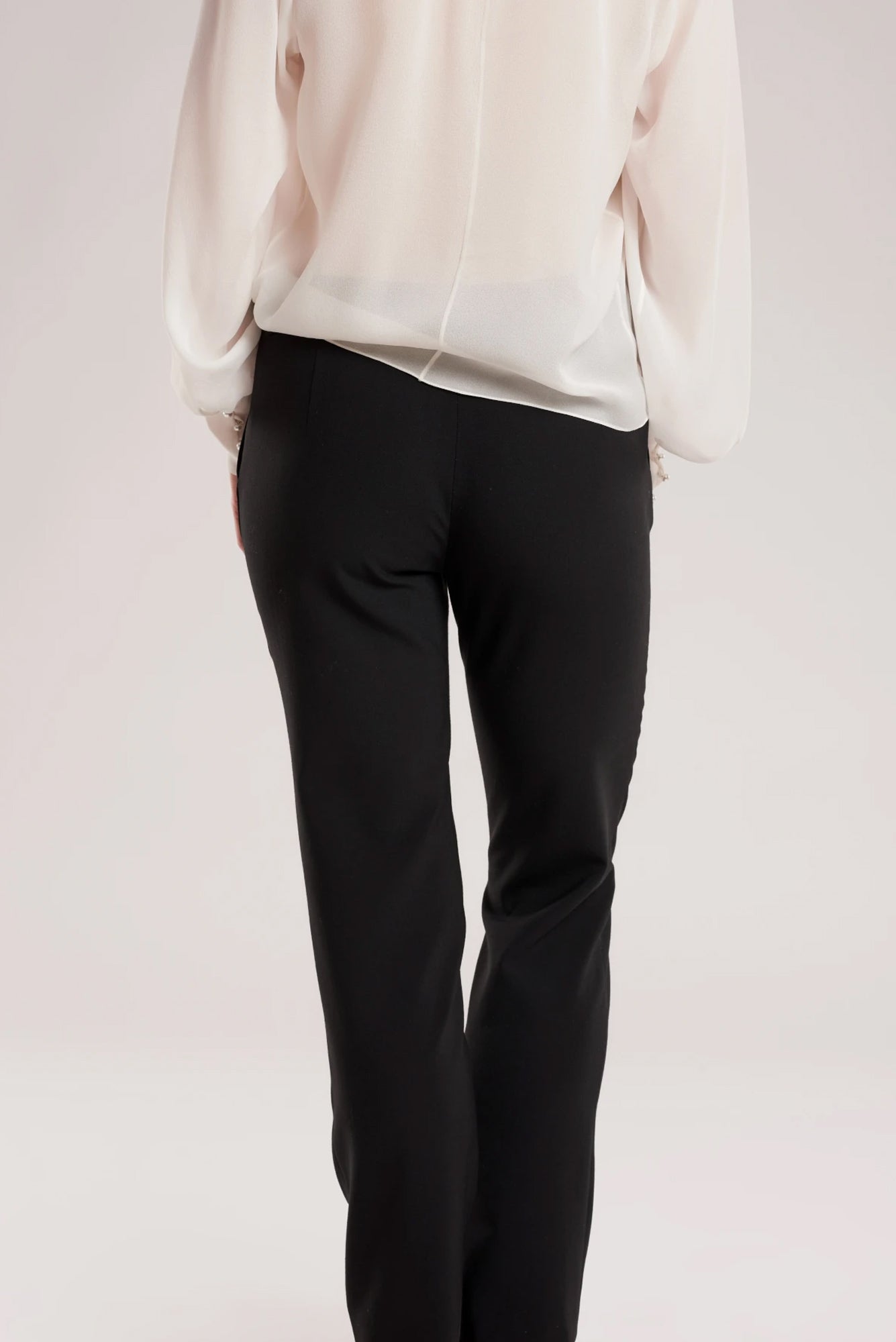 GINTA's classic straight-leg black pants are another foundation piece for your wardrobe.