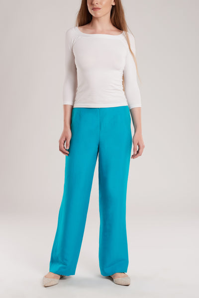 These wide-leg pants are tailored from a luxurious silk and linen blend in vibrant turquoise. 