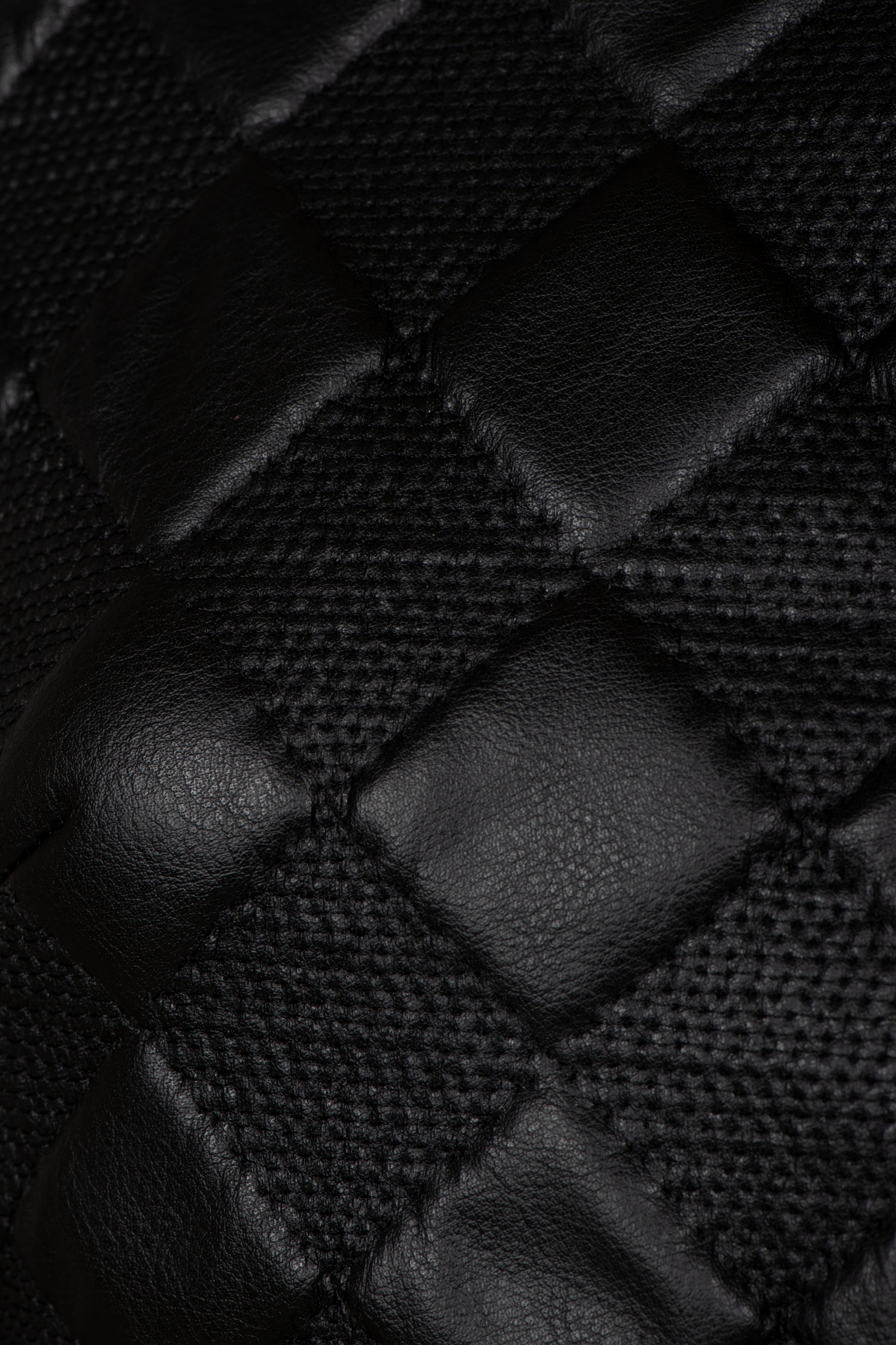 The black jacket is tailored from exquisite diamond quilted artificial leather. 